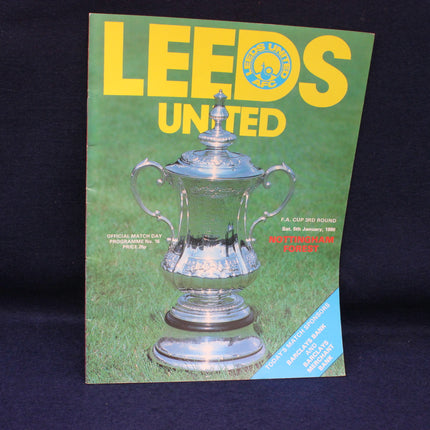 Leeds United football club programme with a silver trophy on a green background