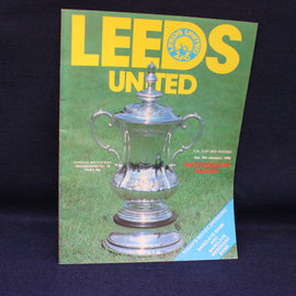 Leeds United football club programme with a silver trophy on a green background