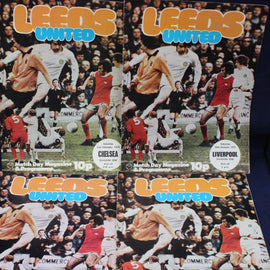 Four Leeds United match day programmes from different matches.