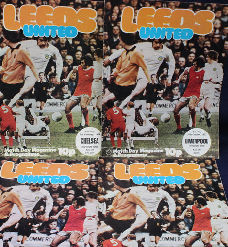 Four Leeds United match day programmes from different matches.