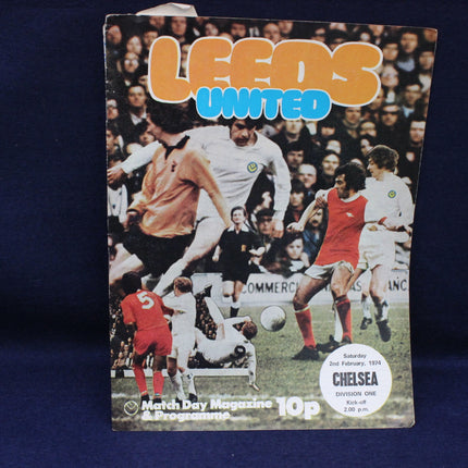 Vintage Leeds United match day magazine cover with soccer players and text.