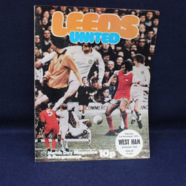 Vintage Leeds United football match programme cover with players on a blue background