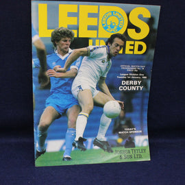 Soccer match program featuring Leeds United and Derby County on a blue background