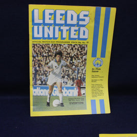 Leeds United football programme with a player on the cover against a dark background
