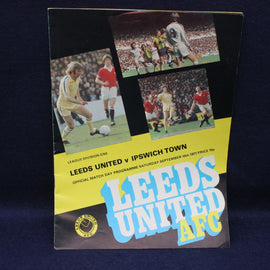 Vintage Leeds United AFC football match programme against Ipswich Town on a dark background