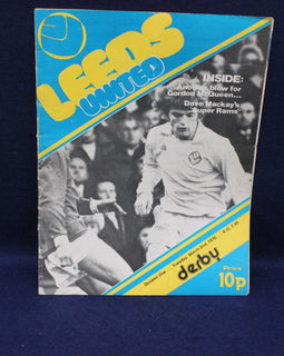 Vintage sports program cover for Leeds United with a player image and text on a blue background