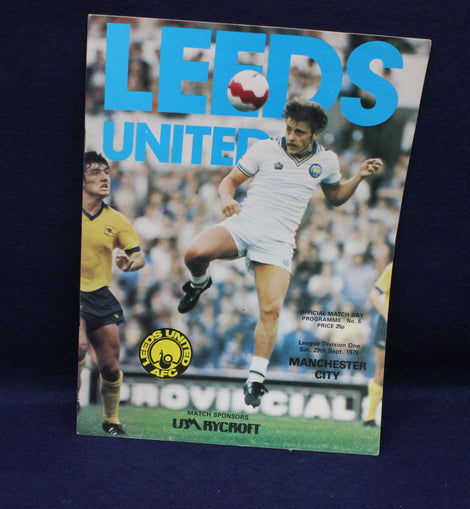 Soccer match program for Leeds United featuring a player in action on a blue background