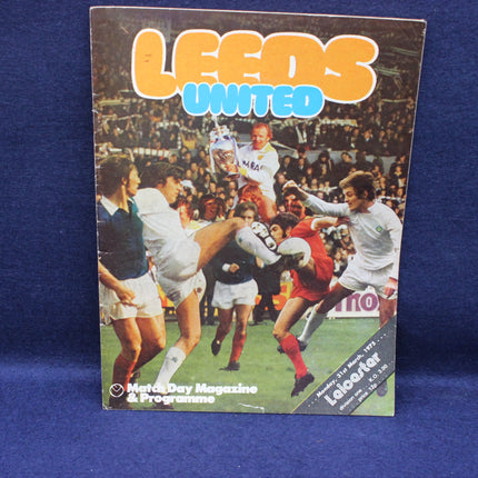 Soccer program for Leeds United with players on the cover against a blue background