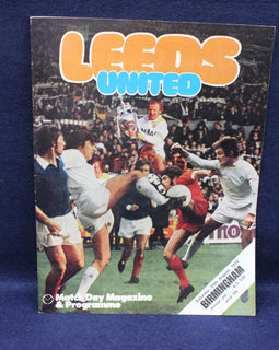 Leeds United match day magazine and programme cover with soccer players on a blue background