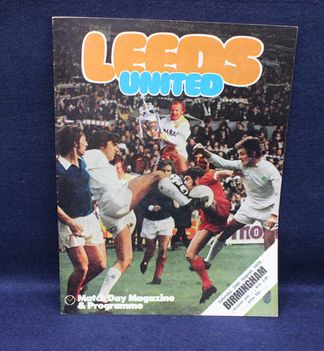 Leeds United match day magazine and programme cover with soccer players on a blue background