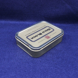 Tin box labeled 'Gold Block' on a blue background