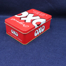 Red OXO tin box on a blue background