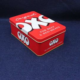 Red OXO tin box on a dark blue background