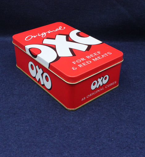 Red OXO tin box on a dark blue background