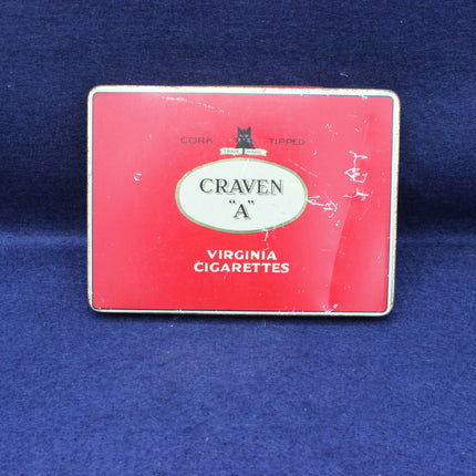 Vintage Craven 'A' Virginia Cigarettes tin on a blue background