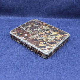 Vintage tortoiseshell case on a blue background