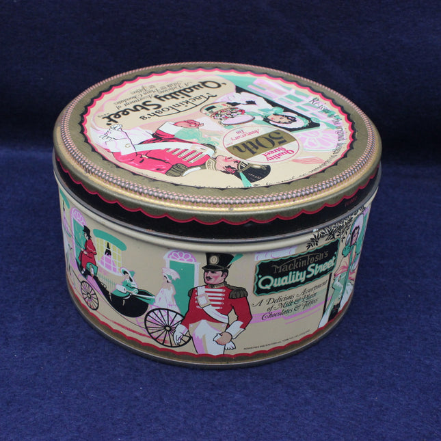 Round vintage-style tin with colorful graphics on a blue background