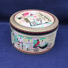 Decorative round tin with colorful illustrations on a blue background