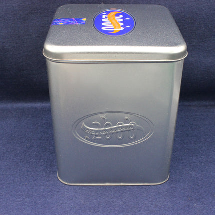 Silver metal tin with a logo on a blue background