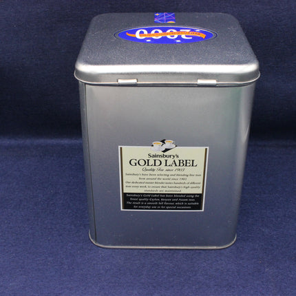 Sainsbury's Gold Label tea tin on a blue background