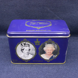 Blue tea tin with portraits of a monarch on a dark blue background