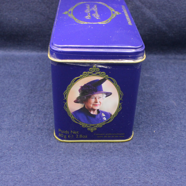 Blue tea tin with a portrait of a queen on a blue background
