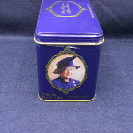 Blue tea tin with a portrait of a queen on a blue background