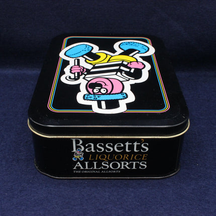 Bassetts Liquorice Allsorts tin with colorful design on a dark blue background