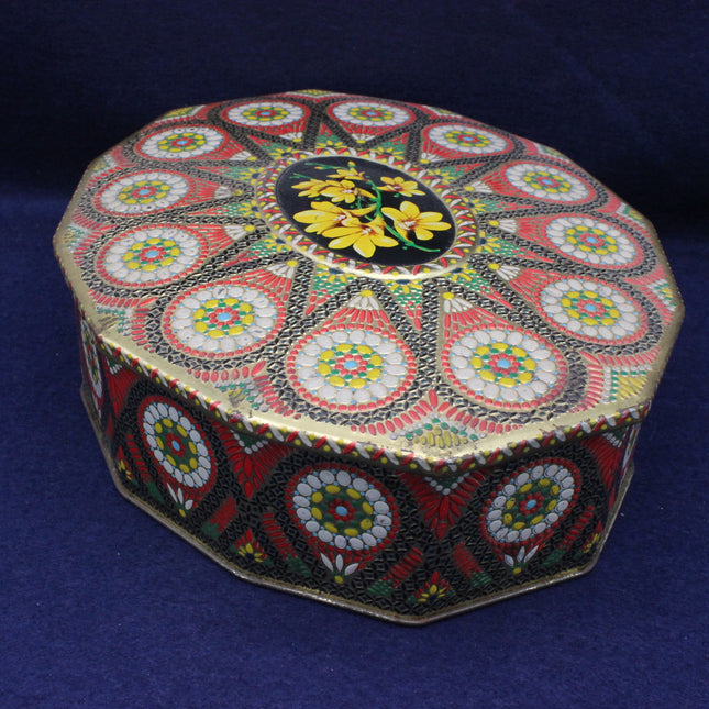 Decorative box with intricate patterns on a blue background