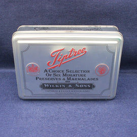 Tiptree preserve tin with red and black text on a blue background