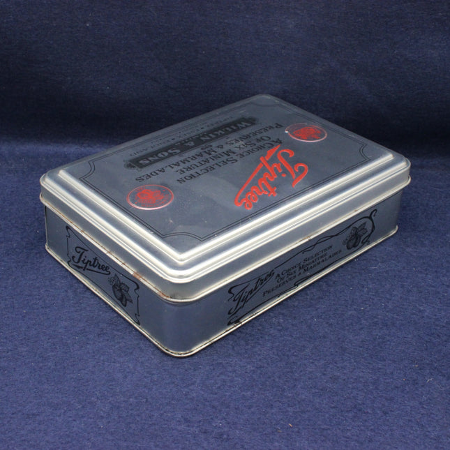 Tin box with Typhoo branding on a blue background