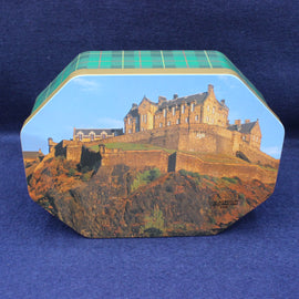 Hexagonal tin with a castle design on a blue background