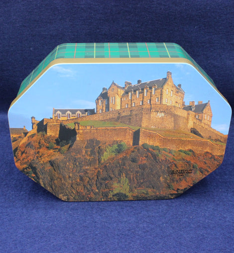 Hexagonal tin with a castle design on a blue background