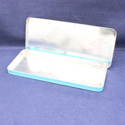Metallic rectangular tray with a lid on a blue background