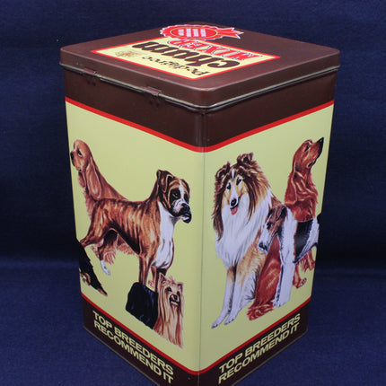Vintage-style tin box with dog illustrations on a blue background