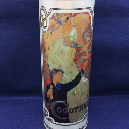Decorative cylindrical container with artistic design on a blue background
