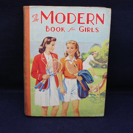Book cover titled 'The Modern Book for Girls' featuring two girls with tennis rackets on a blue background