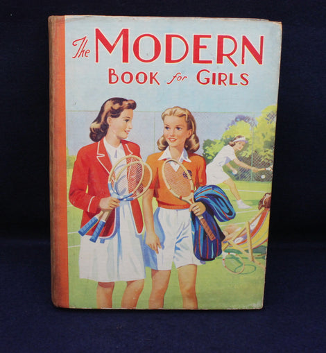 Book cover titled 'The Modern Book for Girls' featuring two girls with tennis rackets on a blue background