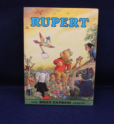 Rupert Annual book cover with cartoon characters on a blue background