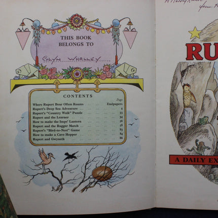 Open book with decorative cover and contents list, featuring illustrations of animals and birds.