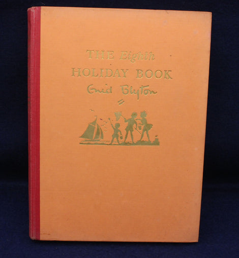 Book titled 'The Eighth Holiday Book' by Enid Blyton with a red spine on a dark background