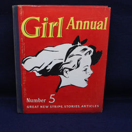 Red book titled 'Girl Annual Number 5' with a black and white illustration of a girl on a dark blue background