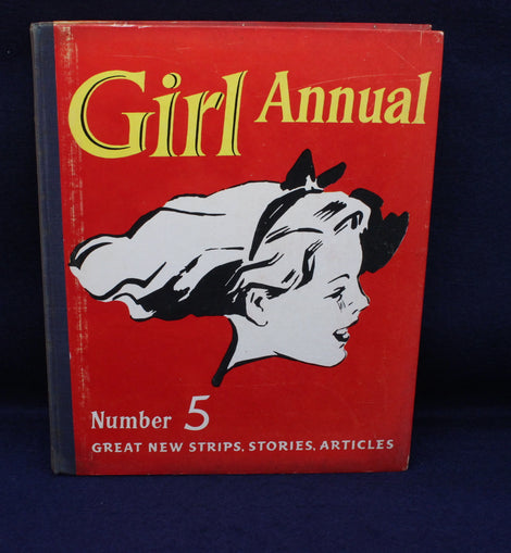 Red book titled 'Girl Annual Number 5' with a black and white illustration of a girl on a dark blue background