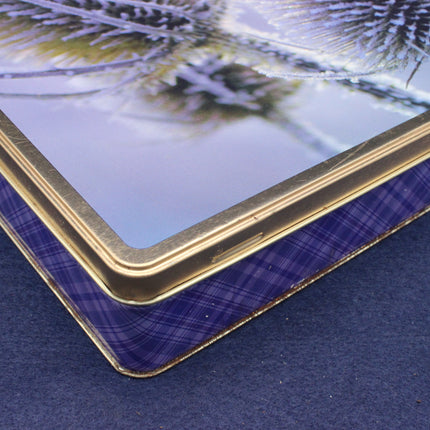 Close-up of a glass panel with a gold frame on a blue surface