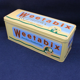 Weetabix tin with decorative design on a blue background