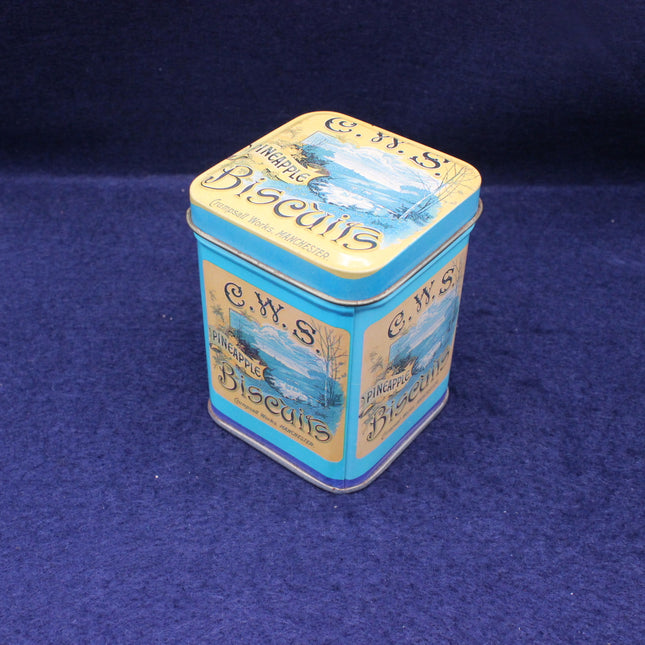 CWS Pineapple Biscuits tin on a blue background