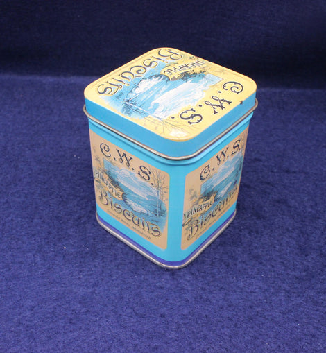 CWS Biscuits tin on a blue background