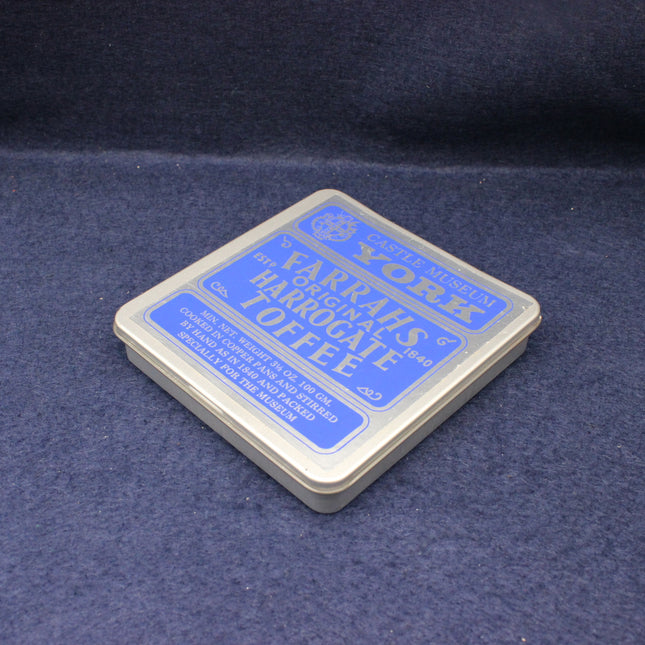 Warrahs Harrogate Toffee packaging on a dark blue fabric background