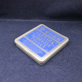 Warrahs Harrogate Toffee packaging on a dark blue fabric background