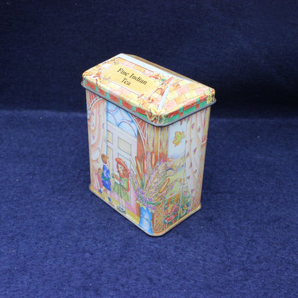 Decorative tea tin with colorful design on a blue background
